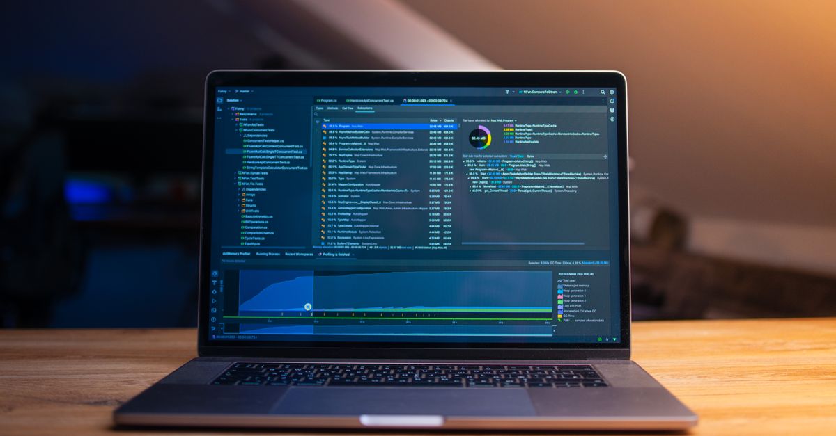 A laptop on a desk with code on the screen in a quiet workspace, illustrating the September 2026 Windows security update